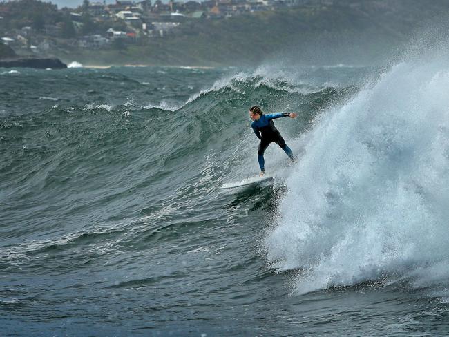 Surfers take advantage of big swells hitting the Central Coast, off The Haven at Terrigal. Picture: Troy Snook