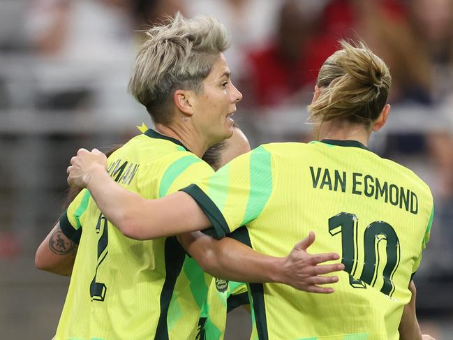 GLENDALE, ARIZONA - FEBRUARY 23: Michelle Heyman #2 of Australia celebrates with Emily van Egmond #10 after scoring a goal against the United States during the second half of the 2025 SheBelieves Cup match at State Farm Stadium on February 23, 2025 in Glendale, Arizona. (Photo by Chris Coduto/Getty Images)