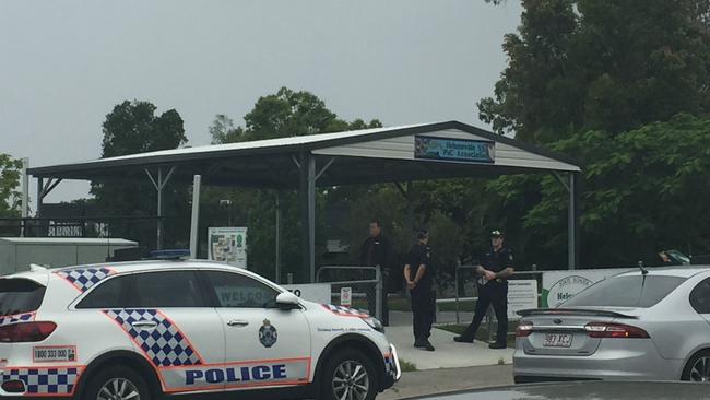 Police at Helensvale State School during a lockdown yesterday.