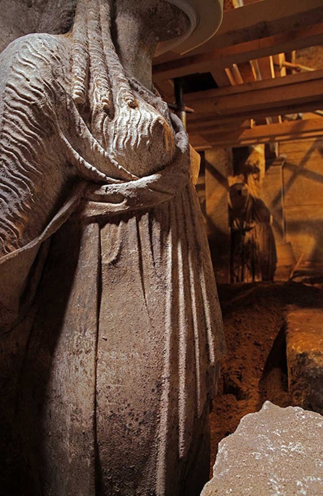 Strong presence ... Timber beams shore-up the roof between the two female statues guarding the entrance to the third chamber.