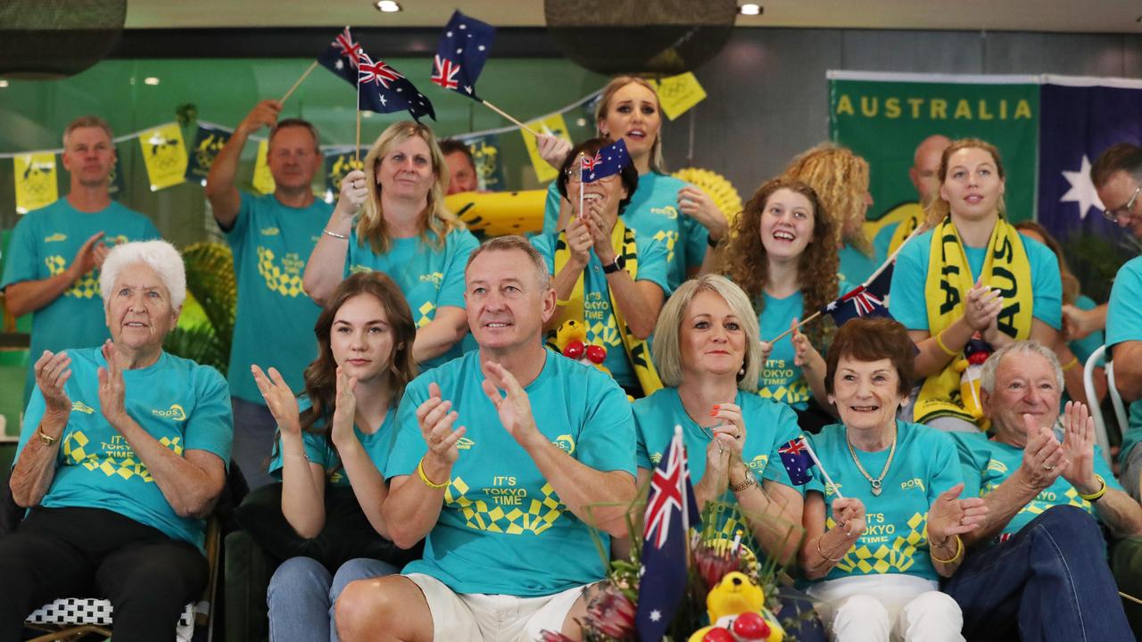 Steve and Robyn Titmus cheer Ariarne on during the race with friends and family at Noosa. Picture: Lachie Millard