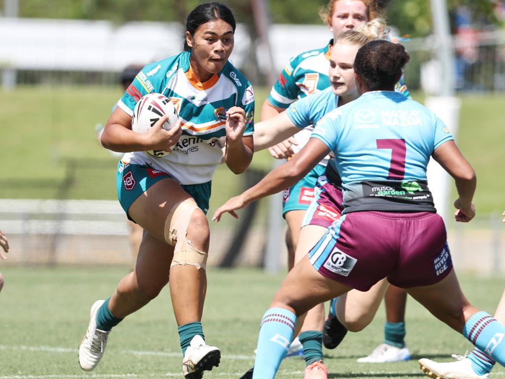 Mariah Tihopu runs hard towards the Cutters' defence in the Queensland Rugby League (QRL) Under 19 Women's match between the Northern Pride and the Mackay Cutters, held at Barlow Park. Picture: Brendan Radke