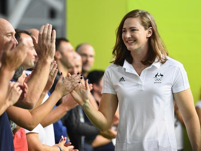 Cate Campbell is congratulated by team members after getting her ticket to the Rio.