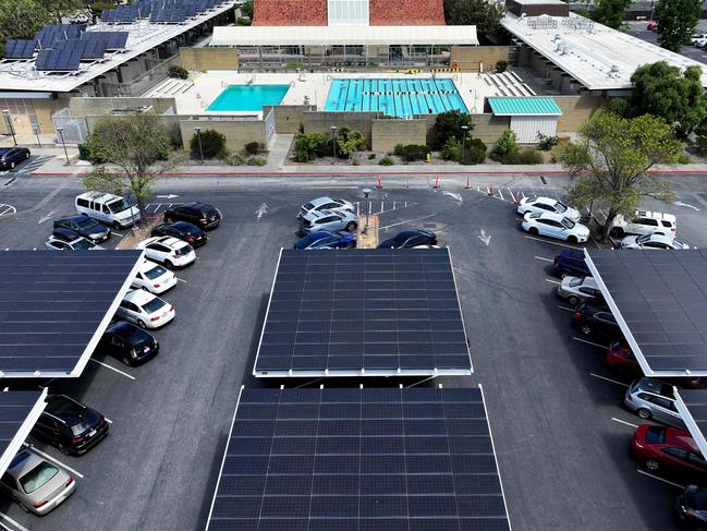 KENTFIELD, CALIFORNIA - APRIL 25: In an aerial view, solar panels are seen in the parking lot at College of Marin on April 25, 2024 in Kentfield, California. California has cut back on rooftop solar incentives as the state has an estimated 47 gigawatts of solar power installed, nearly 25 percent of the state's electricity, that powers 13.9 million homes. On days where there is little demand for electricity, the price of electricity flattens and gigawatts of the solar generated power is curtailed.   Justin Sullivan/Getty Images/AFP (Photo by JUSTIN SULLIVAN / GETTY IMAGES NORTH AMERICA / Getty Images via AFP)