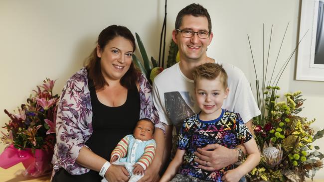 Charlie was the last baby born at Knox Private Hospital. Jenna and John Newbigin with the newborn and his brother Harry. Picture: Valeriu Campan