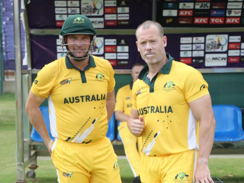 Luke Jackson (left) preparing to bat in the green and gold at the Over 40s Global Cup in Karachi. Picture: Supplied.