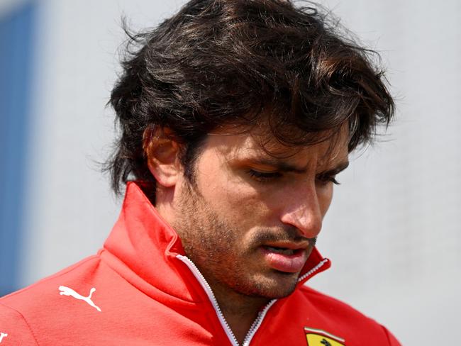 JEDDAH, SAUDI ARABIA - MARCH 06: Carlos Sainz of Spain and Ferrari walks in the Paddock during previews ahead of the F1 Grand Prix of Saudi Arabia at Jeddah Corniche Circuit on March 06, 2024 in Jeddah, Saudi Arabia. (Photo by Clive Mason/Getty Images)