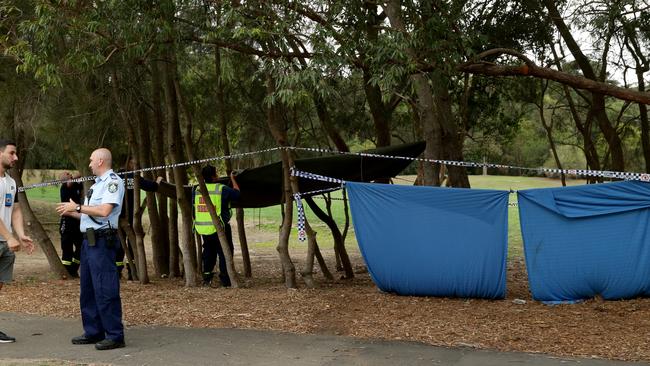 Firefighters set up a tarp over the crime scene at Buffalo Creek Reserve Playground in Hunter’s Hill after Nicole’s body was discovered. Picture: Jonathan Ng