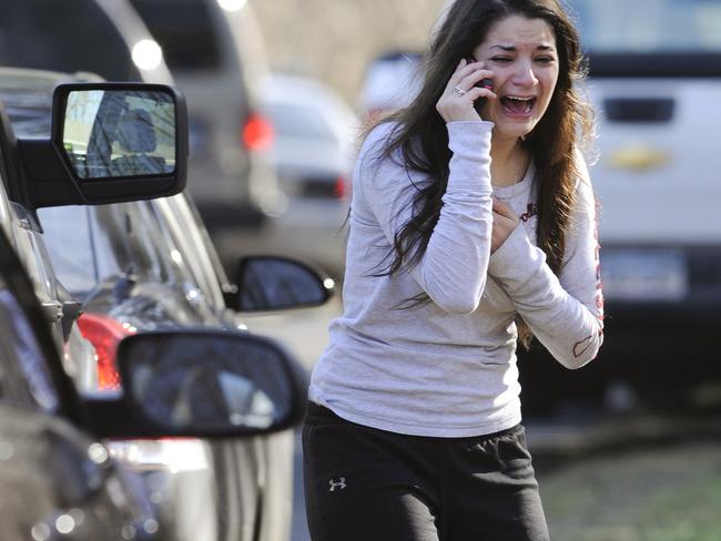 Carlee Soto, pictured, makes a call about her sister, Victoria Soto, a 27-year-old teacher who was one of those killed at the Sandy Hook shooting in December 2012. Picture: AP Photo/Jessica Hill