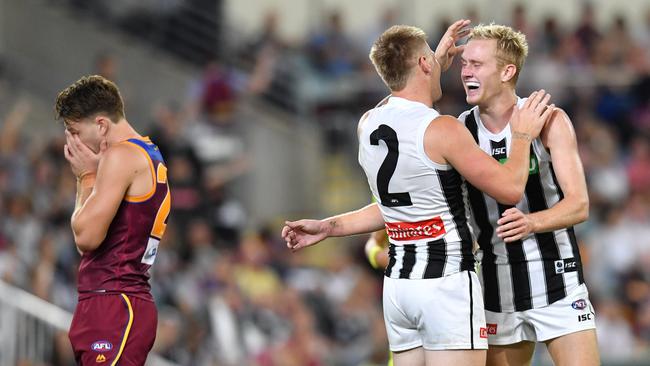 Jordan De Goey and Jaidyn Stephenson celebrate a goal during Collingwood’s dominant second half. Picture: AAP Image/Darren England.