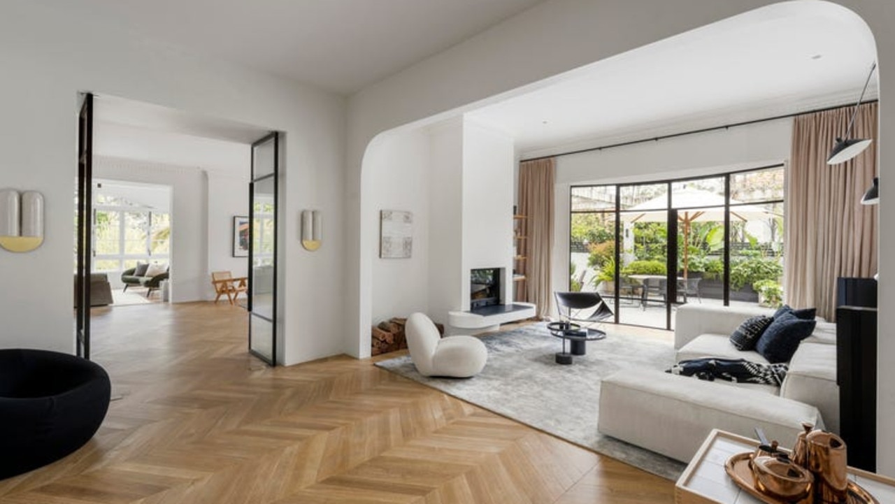 Multiple living spaces throughout the home feature extensive natural light.