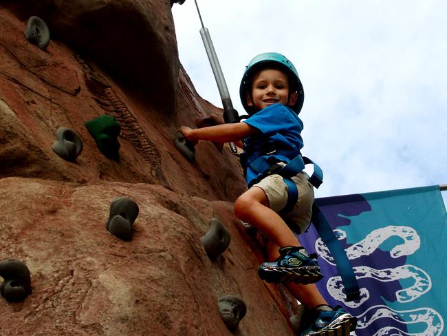 Bryson Boger enjoys the climbing wall.