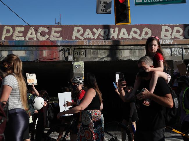 Demonstrators march through the streets against police brutality and racism. Picture: AFP