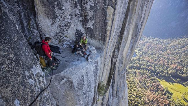 Honnold meeting climbers as he rappels El Capitan's Freerider route to practice on the climb before his free solo attempt. Picture: National Geographic/Jimmy Chin