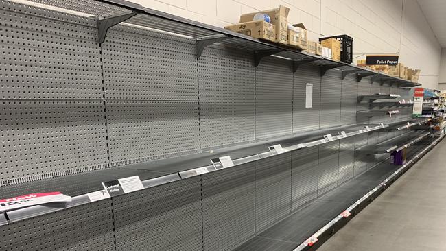 Major Darwin supermarkets are appealing to shopping hoarders to stop the panic buying and give everyone a chance to buy food and other essentials. Pictured are empty shelves at Karama shopping centre on Friday morning, .