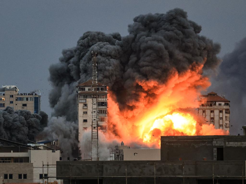 Fire and smoke rise above a building in Gaza City. Picture: Mahmud Hams/AFP