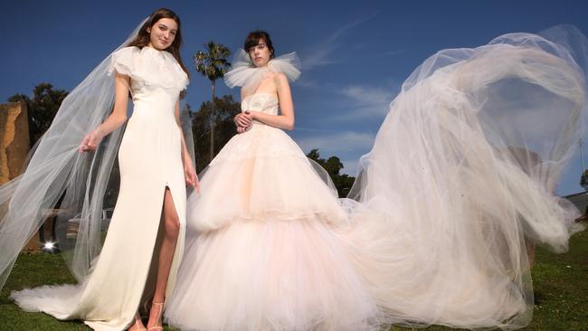 Models Julz (left) wearing a Lexi gown, Imogen veil and lace capelet, and Ashlee wearing a Sigourney gown and tulle ruff. <s1>Picture: Chris Pavlich</s1>