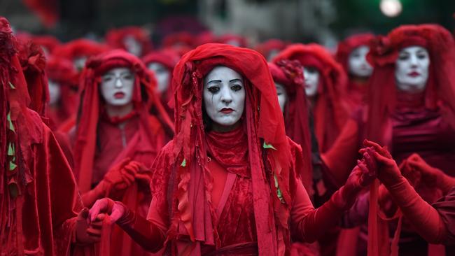 The Red Brigade of the Invisible Circus during a climate change protest at the Houses of Parliament at Westminster in London in 2019. Picture: Getty Images