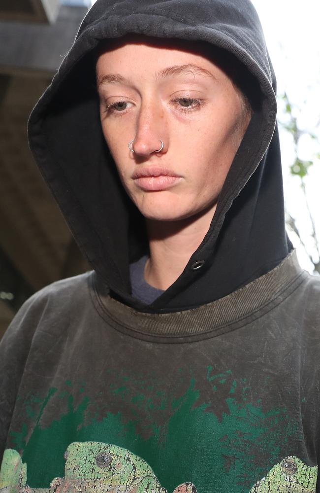 Blockade Australia protesters are released on bail from Surry Hills Police Station. Pictured is Mali Cooper, who blocked the Harbour Tunnel and used a bike lock around her neck and steering wheel to lock herself in the car. Picture: NCA NewsWire / David Swift