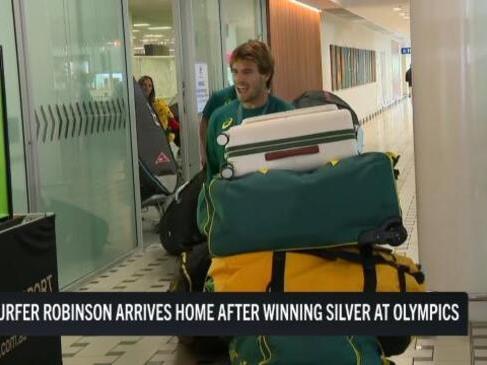 Jack Robinson returns after winning silver in the Olympic surfing