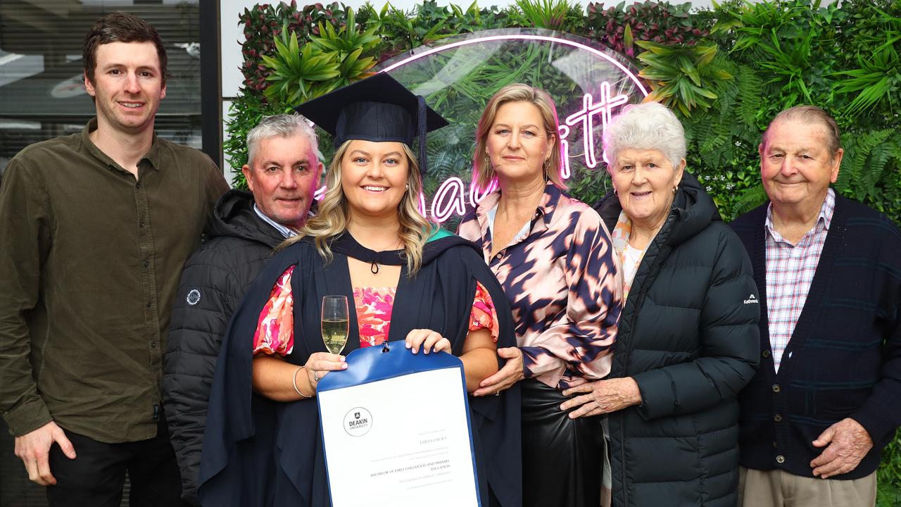 Deakin graduate Emma Croft, with partner Matthew Said, left, parents Darren and Tanya and grandparents Pat and Ken. Picture: Alison Wynd