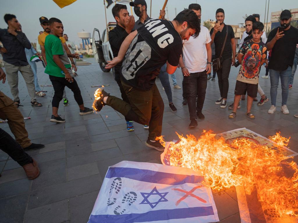 Iraqis burn Israeli flags during a rally held in central Baghdad. Picture: AFP