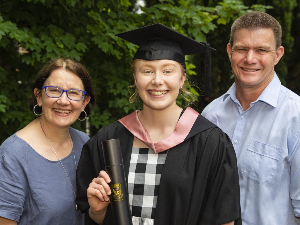 Master of Learning and Teaching graduate Rebecca Peake with parents Kathy and Allan Peake at the UniSQ graduation ceremony at Empire Theatres, Tuesday, December 13, 2022. Picture: Kevin Farmer