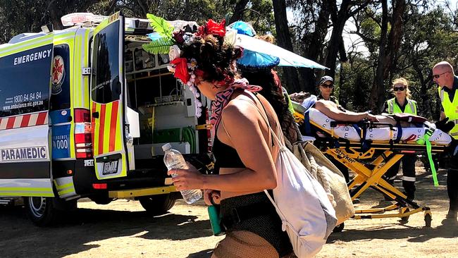 Talking to your parents or guardian about taking party drugs is an essential conversation. Here a young man is taken to hospital at the Rainbow Serpent Festival.