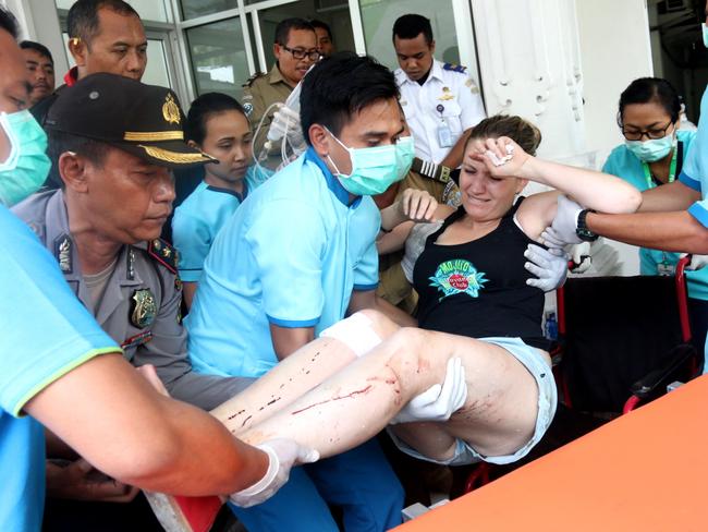 French national Mile Charroin Amelie is placed on a stretcher after the Gili Cat 2 fast boat exploded shortly after leaving Padang Bai port in Karangasem, eastern Bali. Picture: Lukman S. Bintoro