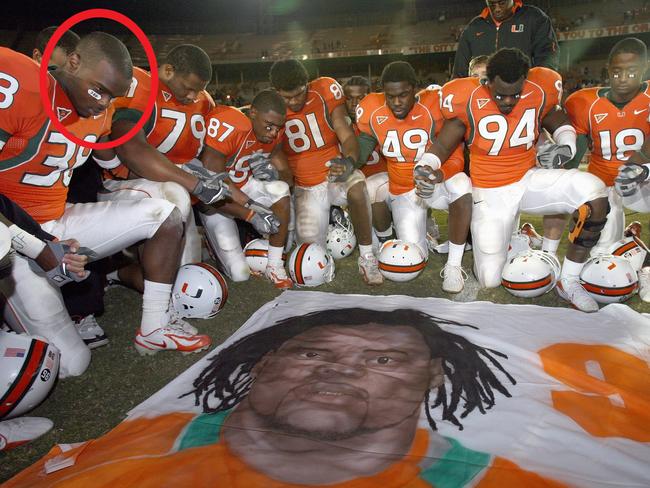 Teammates of Bryan Pata - including Rashaun Jones, circled - say a prayer over a mural that was placed at mid-field in 2006. Jones was arrested in connection with Jones' killing this week. (Photo by Doug Benc/Getty Images)