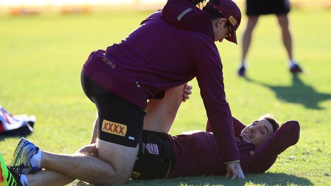 Billy Slater gets a stretch before a Queensland Origin training session. Picture: Adam Head