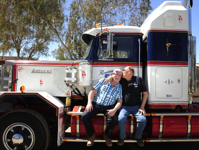 Old Truckers Ted Bushby(driving 45years) receives a kiss on the head from old mate Ray Scott. Both have not seen each other for thirty years and were reunited at the Road Transport Hall of Fame on the weekend. They are pictured in front of one of Rays old truck which was used in the ANT to cart Fuel from Darwin between the years 1978-97. Picture Justin Brierty