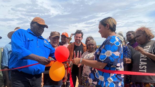 Central Desert Regional Council president Adrian Nixon and Essential Services Minister Selena Uibo cut the ceremonial ribbon at the opening of the Laramba water treatment plant.