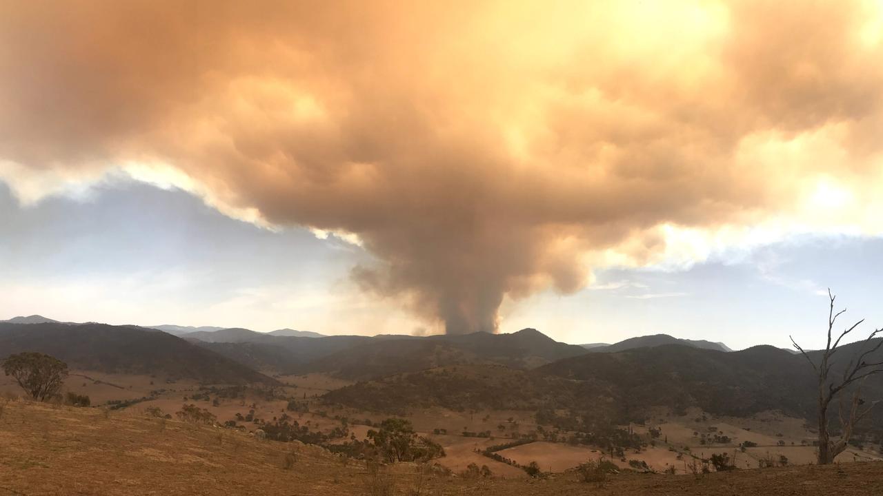 Disaster approaching ... Kate Hudson captured this image of the beginnings of the Orroral Valley fire in January 2020. It is among many taken by members of the public and included in Fighting Spirit.