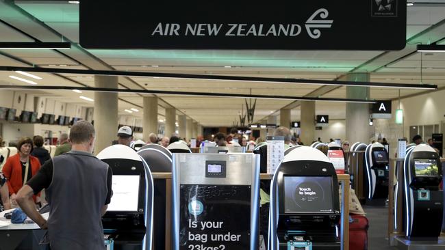 Passengers check in for their flights at Christchurch Airport in New Zealand on Monday. Picture: AP Photo/Mark Baker.