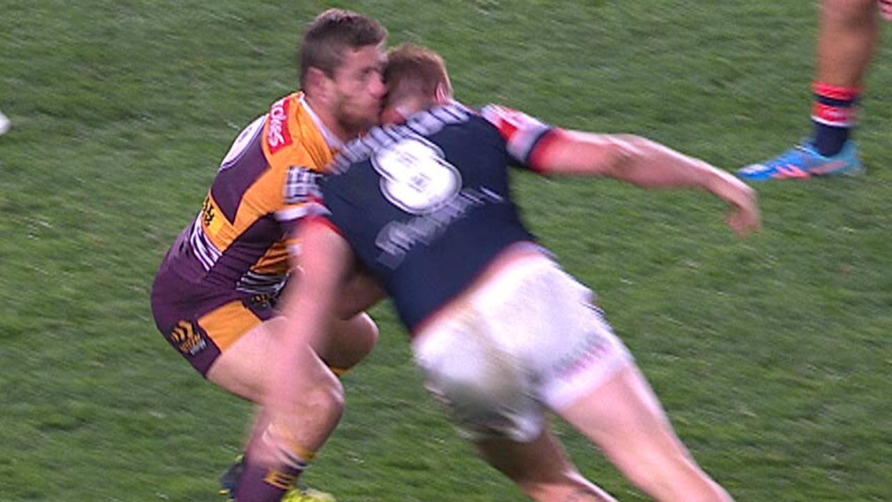 Sydney Roosters forward Dylan Napa knocks out Brisbane Bronco Andrew McCullough.