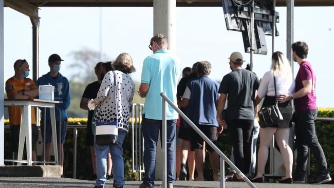 Lines at the vaccine hub at Doomben racecourse. Photo: Annette Dew