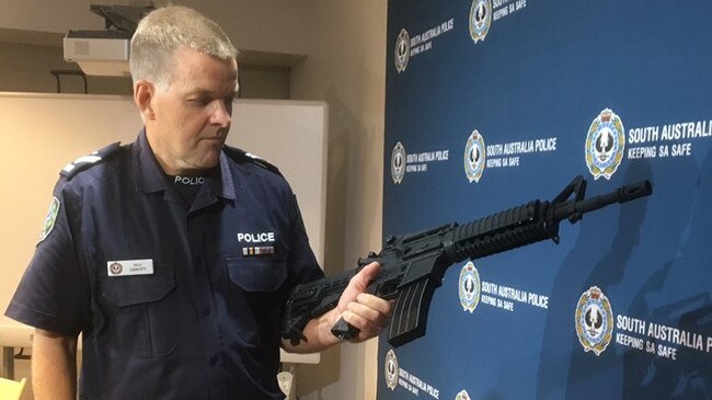 A police officer with gel blaster gun