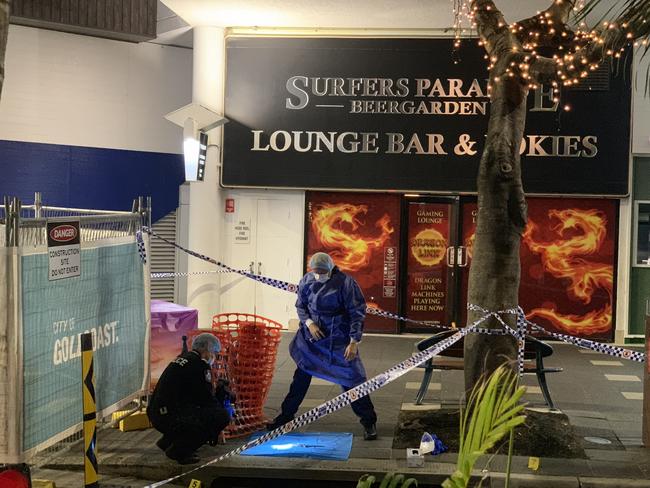 Police at the scene of the fatal stabbing of Raymond Harris outside the Beer Garden at the corner of Cavill Mall and Orchid Avenue in September 2020. Picture: Ryan Keen