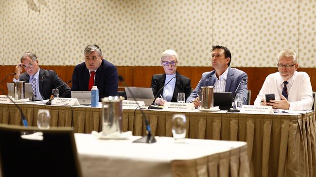 The Economics and Governance Committee meet for a public hearing into the proposed Strengthening Community Safety Bill at the Pullman Reef Casino Hotel. Committee members Adrian Tantari (Member for Hervey Bay) Chairman Linus Power (Member for Logan), Committee Secretary Jillian Langford, Dan Purdie (Member for Nindery) and Michael Crandon (Member for Coomera) at the hearing meeting. Picture: Brendan Radke