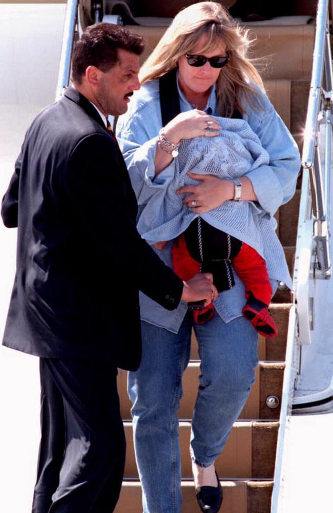 Rowe carries baby Prince in Vienna in July of 1997. 