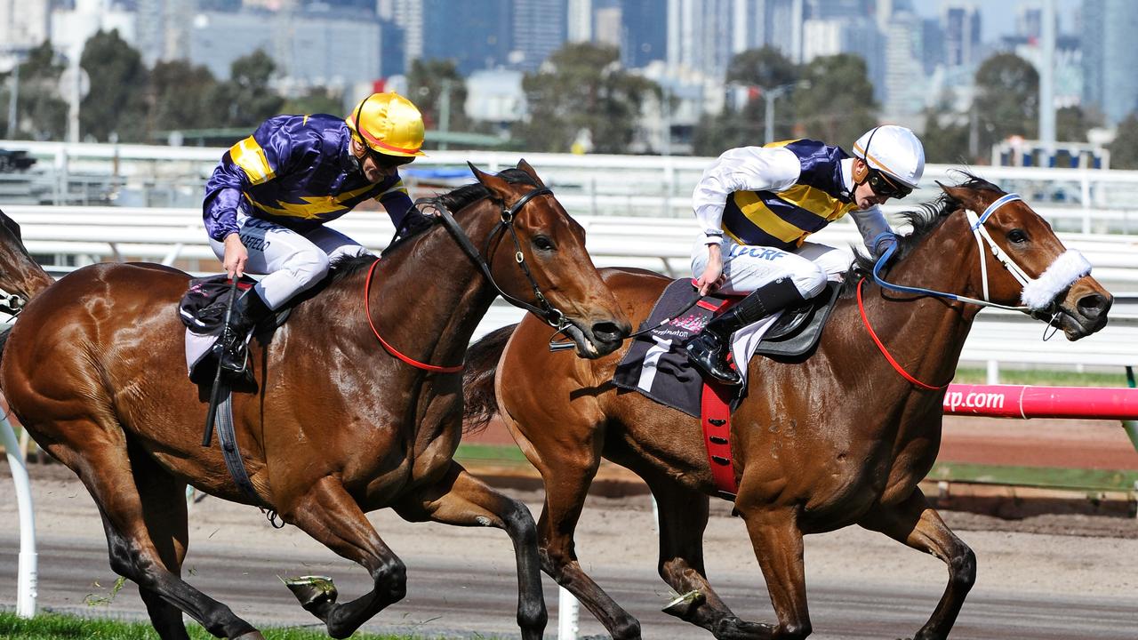 Chad Schofield aboard Brambles beating father Glyn on Big Memory at Flemington in 2014. Picture: Vince Caligiuri-Getty Images