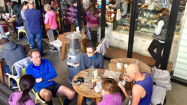 The weekend crowd gather outside the Albany St cafe.