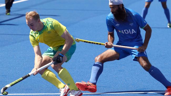 Australia's Jacob Anderson (L) vies with India's Singh Jarmanpreet during the men's gold medal hockey match between Australia and India on day eleven of the Commonwealth Games at the University of Birmingham Hockey and Squash Centre in Birmingham, central England, on August 8, 2022. (Photo by DARREN STAPLES / AFP)