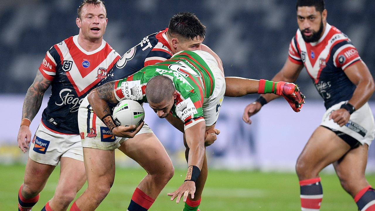 Dane Gagai of the Rabbitohs is tackled by Victor Radley