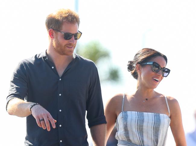 Meghan, Duchess of Sussex walks with Prince Harry along the wharf in Kingfisher Bay. Picture: Chris Jackson/Getty Images