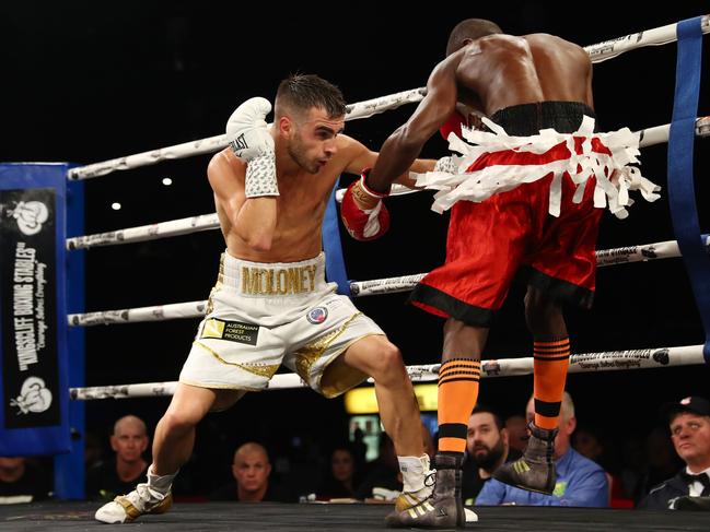 Andrew Moloney punches Selmani Bangaiza during their bout at Seagulls Club on June 15. (Photo by Chris Hyde/Getty Images)