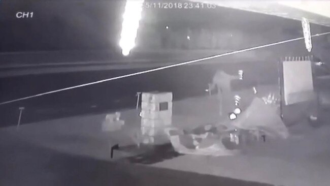 A vandal captured on the home’s security camera pulling lights out of the ground.