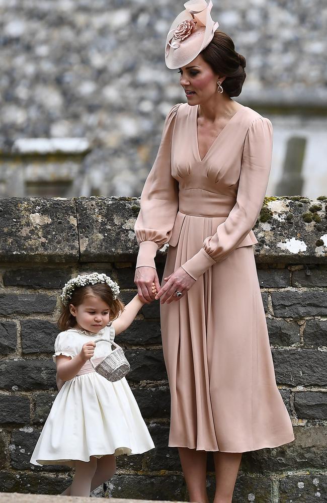 Kate holds Charlotte’s hand following the ceremony. Picture: Justin TALLIS/AFP