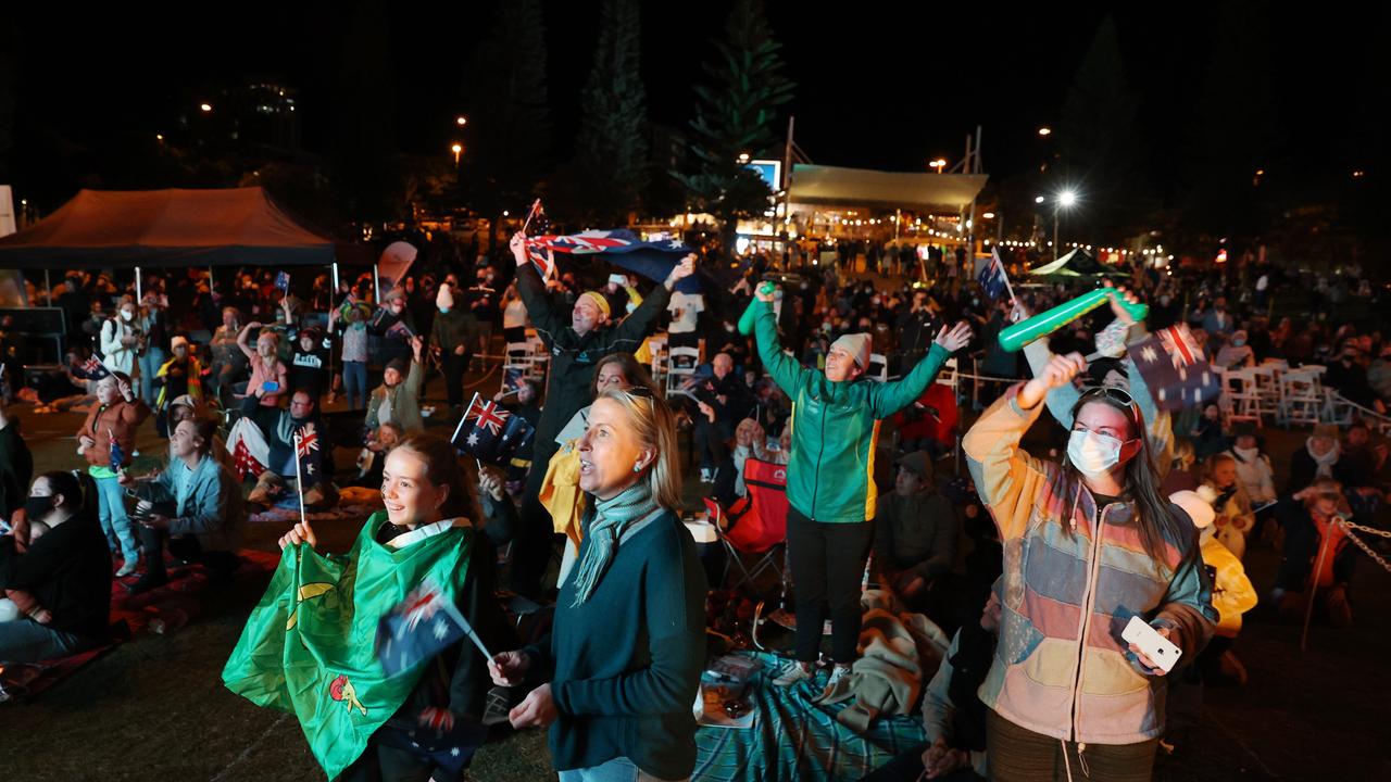 Audience members celebrate at Kings Beach in Caloundra as Brisbane is announced as the host of the 2032 Olympic Games. Picture: Lachie Millard